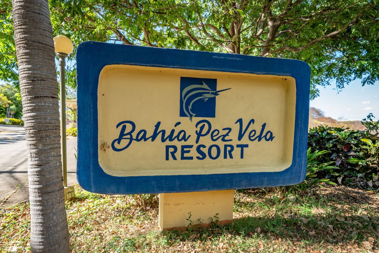 A sign for Bahia Pez Vela Resort.