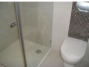 Shower, towels, soap, toilet paper