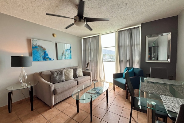 Living area with sofa (sleeps 2) and dining table