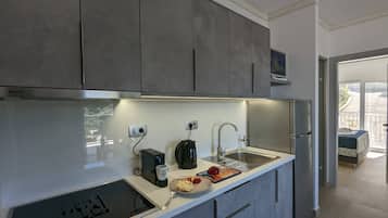 Luxury Apartment | Private kitchen | Full-size fridge, oven, espresso maker, coffee/tea maker