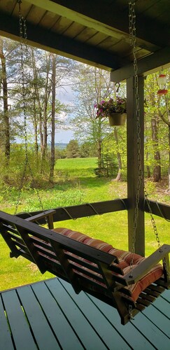 Enjoy the outdoors in this cozy Log Home on top of hill