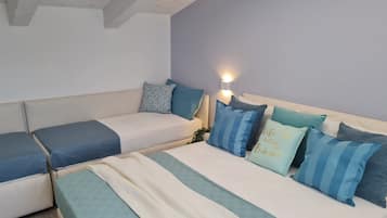 3 habitaciones, tabla de planchar con plancha y cuna de viaje