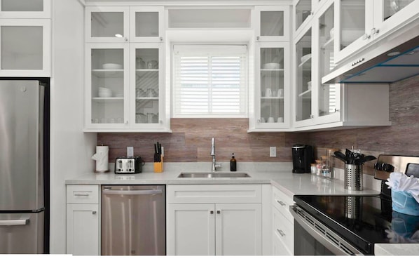 Prepare memorable meals with everything conveniently within reach. - Coastal Getaway for 12 | Private Pool + Beach Access (South Padre Island)
