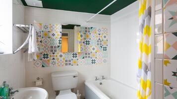 Combined shower/bathtub, hair dryer, towels, soap