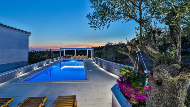 A rooftop pool with a view of the sunset, surrounded by olive trees and a pergola with seating. - Lovely home in Zecevo Rogoznicko (Zecevo Rogoznicko)