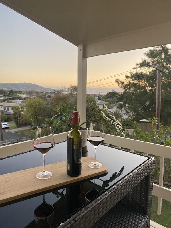 Enjoy a glass of wine on the balcony overlooking the residential area and distant mountains.