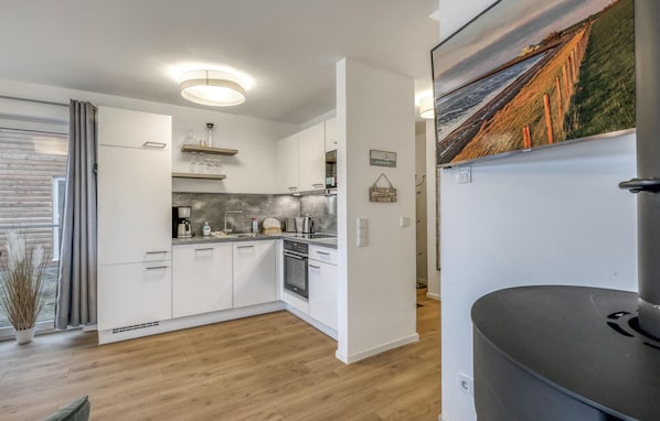 Fridge, stovetop, dishwasher, coffee/tea maker