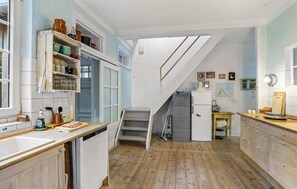 Fridge, stovetop, dishwasher, coffee/tea maker