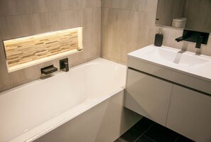 Combined shower/tub, hair dryer, towels, soap