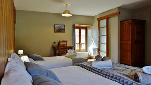A hotel room with two beds, a desk, a chair, a window, and a wardrobe. - Gites for 15 people in the Pyrenees, 250m², Loudenvielle (Loudenvielle)