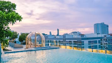 Outdoor pool, open 7:00 AM to 8:00 PM, pool umbrellas, pool loungers