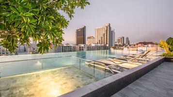 Outdoor pool, open 7:00 AM to 8:00 PM, pool umbrellas, pool loungers