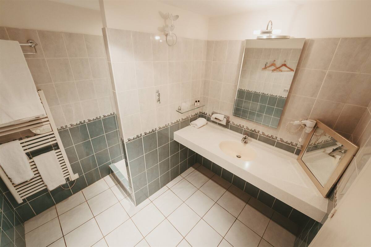 superior double room | bathroom | hair dryer, towels
