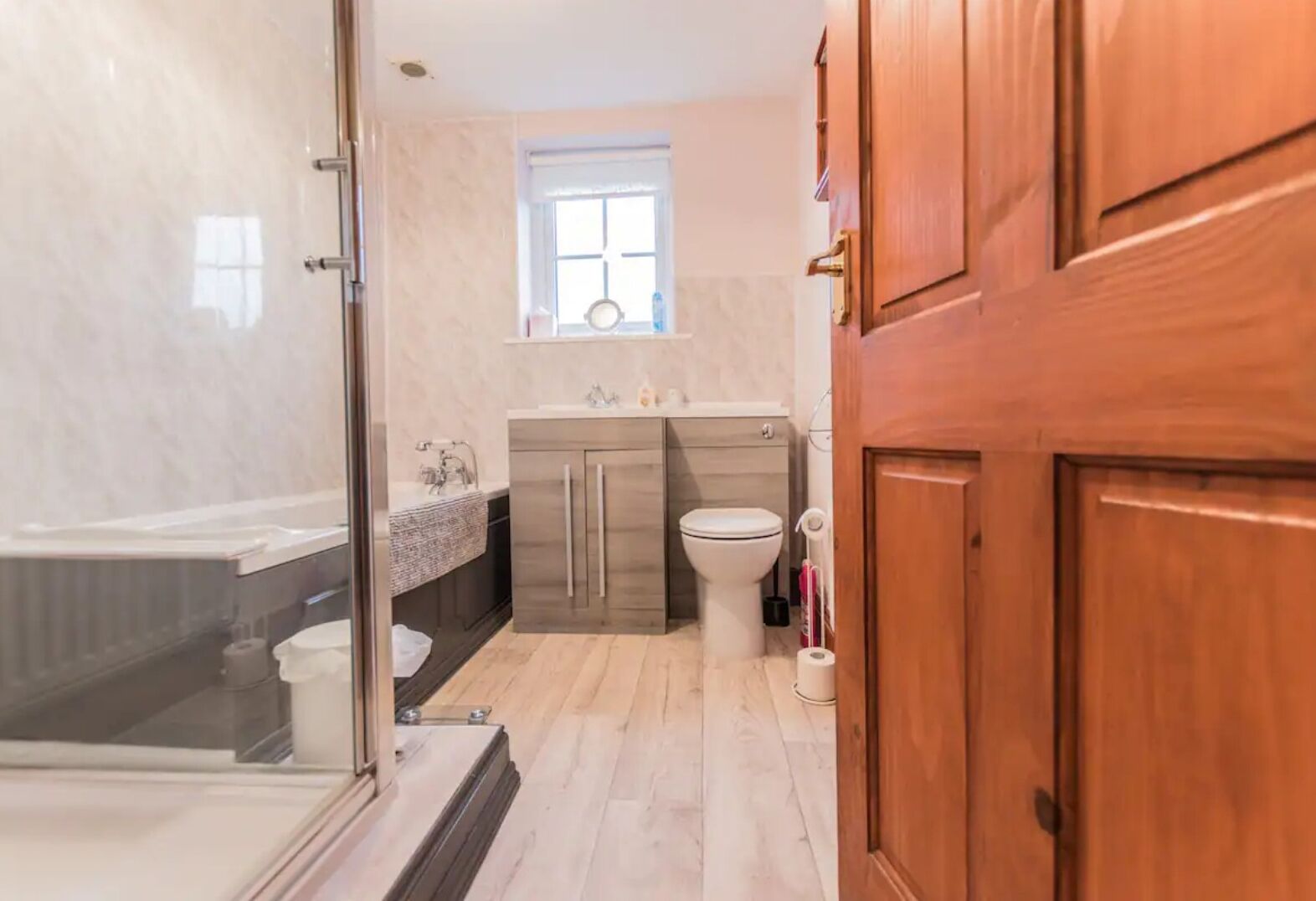 Bathtub, hair dryer, towels, toilet paper