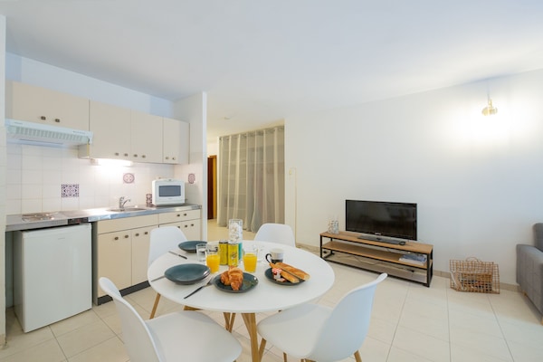 Suite Superior | Area soggiorno | TV a schermo piatto