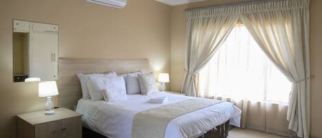 Desk, laptop workspace, free WiFi, bed sheets