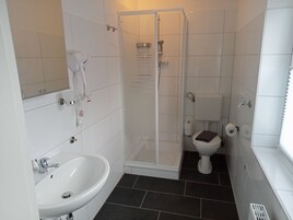 Standard House | Bathroom | Shower, hair dryer, towels