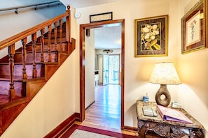 Staircase leads to a bright room with a warm, inviting atmosphere.