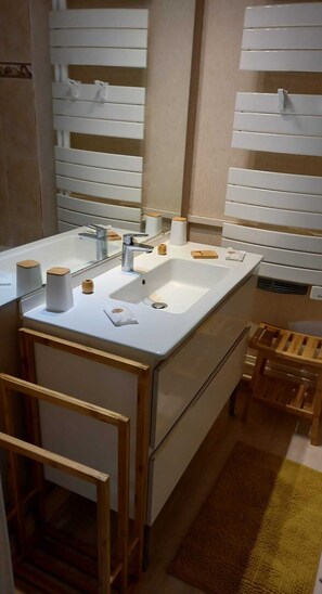 Bathtub, hair dryer, towels, soap