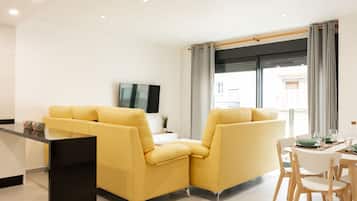 Apartment, 3 Bedrooms | Living room | Flat-screen TV