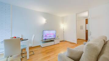 Family Apartment, 1 Bedroom (Locarno best place) | Living area | 21-inch TV with cable channels