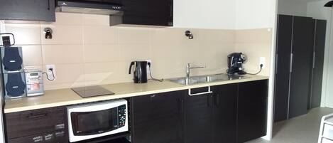 Fridge, microwave, stovetop, coffee/tea maker