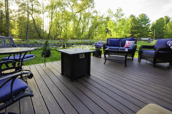 Large outside sitting area with fire table.