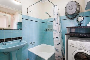 Shower, hair dryer, towels, shampoo