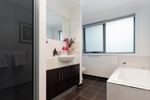Bathtub, hair dryer, towels