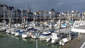 A marina with numerous boats docked, surrounded by buildings. - T2, 4 minutes from Benoît Beach and Port La Baule-Le Pouliguen (La Baule-Escoublac)
