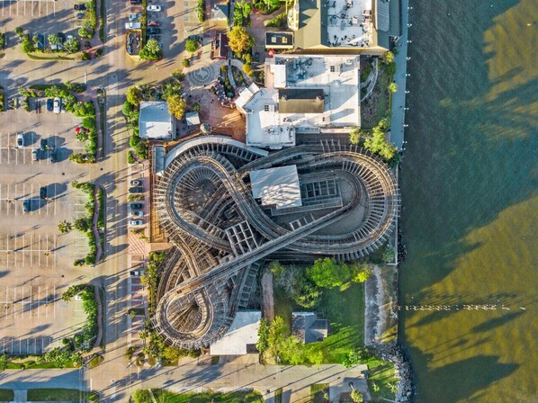An aerial view of a complex railway interchange with multiple tracks and a surrounding urban area.