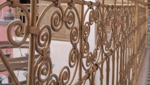 A close-up of ornate metal railings with intricate designs, likely part of a building's exterior. - Charming, quiet and comfortable Riad (Marrakech)