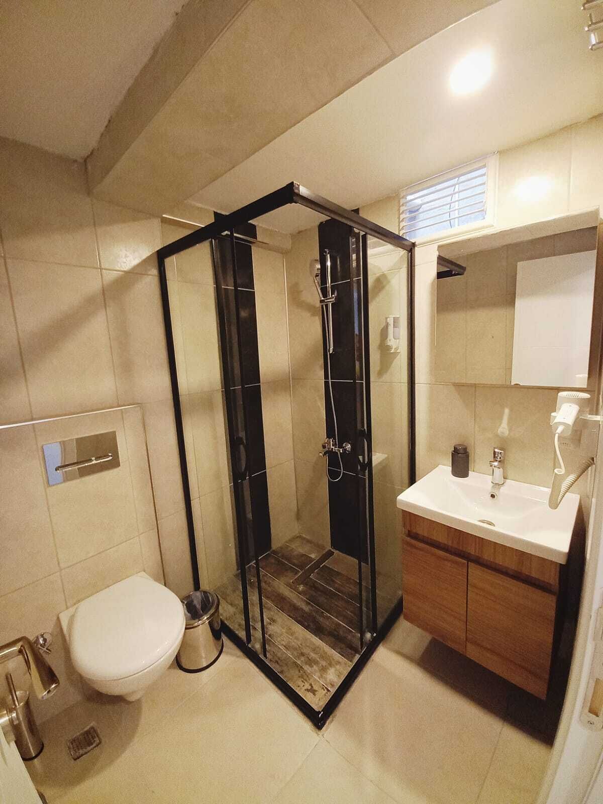 Shower, free toiletries, hair dryer, slippers