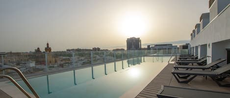 Seasonal outdoor pool, pool loungers