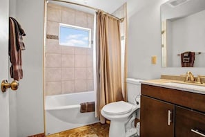 Combined shower/tub, hair dryer, towels, soap
