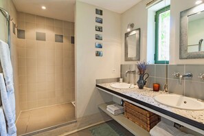 Shower, hair dryer, towels, soap
