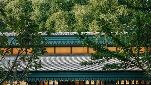 A traditional Japanese-style building with a wooden bench in front, surrounded by lush greenery. - Intercontinental Khao Yai Resort by IHG (Pak Chong)