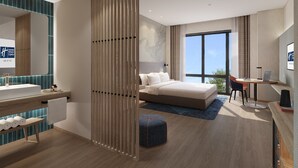 A modern hotel room with a large bed, a desk, a laptop, a bathroom with a large mirror, and a view of the outdoors. - Holiday Inn Express Tengchong Hot Spring by IHG (Baoshan)
