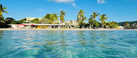 On the beach, sun loungers, beach towels