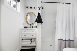 Combined shower/tub, hair dryer, towels, soap