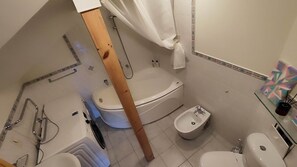 Combined shower/bathtub, hair dryer, bathrobes, slippers - Jurmala Beachfront Art Gallery Mansard Suite in Historic Bath-House (Jūrmala)