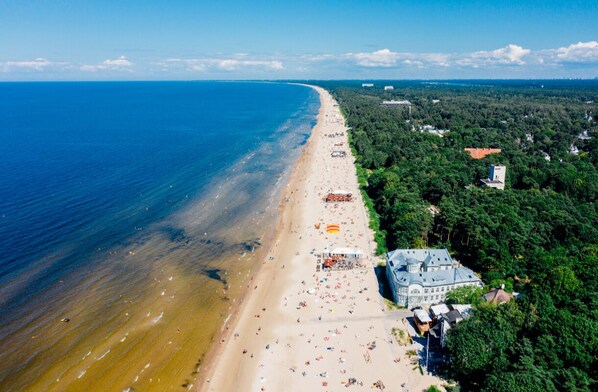 On the beach, sun-loungers, beach towels