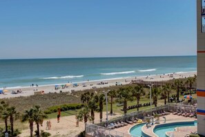 Enjoy the ocean views from our beachfront hotel, featuring a pool area with sun loungers and a water slide.