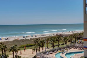 Enjoy the ocean views from our beachfront hotel, featuring a pool area with sun loungers and a water slide.