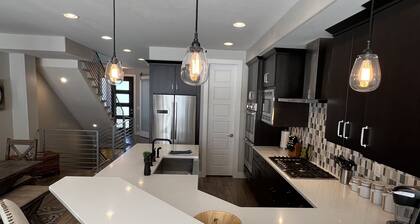 Modern 4-level home, 3500 sq ft, in the Highlands, 3 miles west of downtown.