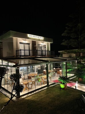 A modern building with a sign reading "DALYAN RISUS SUITE". - Dalyan Risus Suite (Cesme)