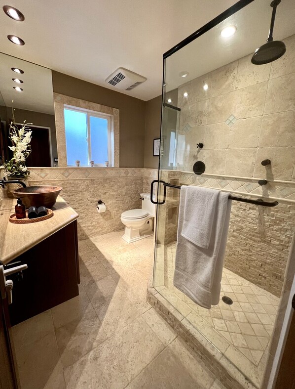 Shower, hair dryer, towels, soap