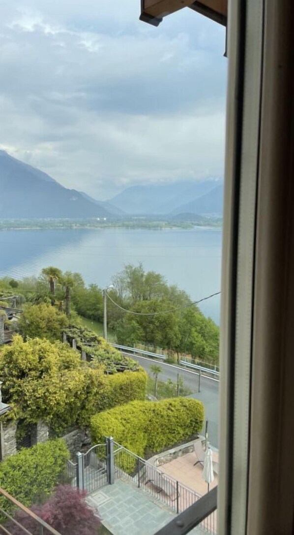 Enjoy breathtaking views of a serene lake and surrounding mountains from the comfort of your room.