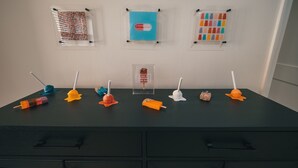 A table with various objects including lollipops and a sign. - Sweet and Spacious Stay Two Blocks from Wildwood's Best Beaches (Wildwood)