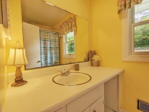 Bathtub, hair dryer, towels